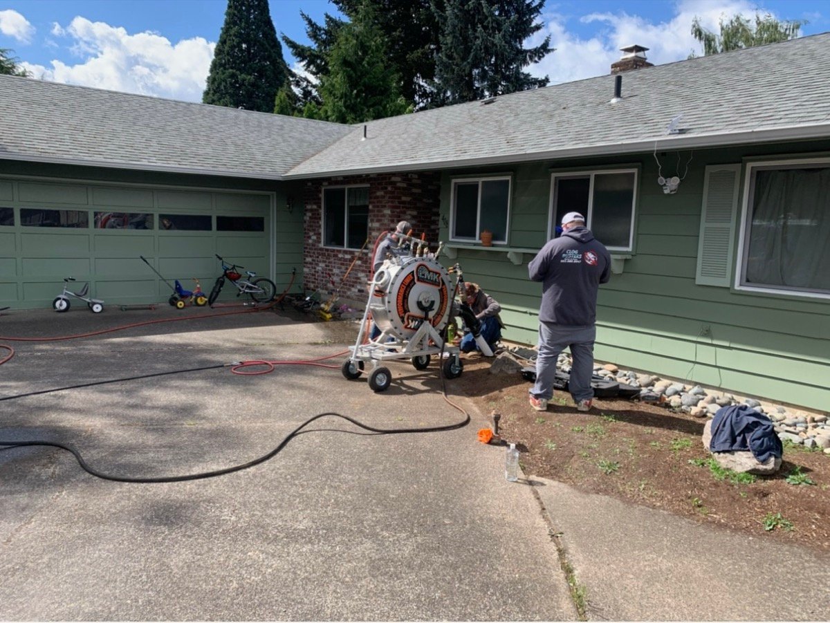CIPP pipe lining crew and LMK inversion drum at Cedar Hills Beaverton Oregon sewer rehabilitation project