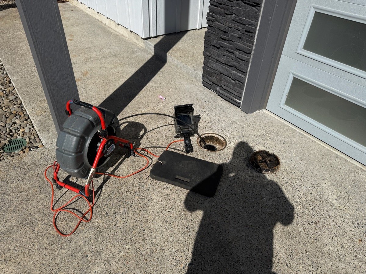 Sewer camera inspection setup at cleanout access point in Oak Hills Beaverton driveway